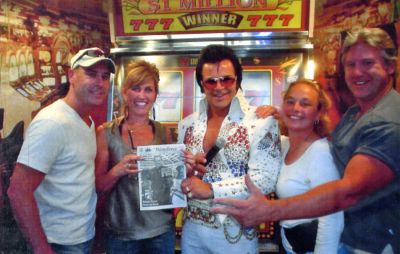 The King and I
Before leaving the building, the one and only Elvis posed with a copy of The Wanderer alongside Paula and Doug Church, owners of Sisters in Mattapoisett, during a recent trip to Las Vegas to attend a Toni & Guy TIGI hair seminar. Ronny and Judy Galley (left), friends of the Churchs, were also visiting Las Vegas at the time to attend Ronnys fathers wedding, and joined them for an audience with The King. (Photo courtesy of Paula Church).
