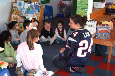 Reading Aloud
On Friday, January 25, Stephen Lynch, whose daughter Sophie attends the schools Kindergarten program, took his turn reading to the children at the Kindercare Learning Center in Marion. The school was celebrating the Patriots trip to this years Super Bowl with a Patriots Day by dressing in team colors to show the spirit and support. (Photo by Robert Chiarito).
