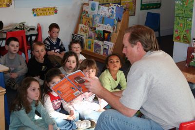 Reading Aloud
On Friday, January 25, Stephen Lynch, whose daughter Sophie attends the schools Kindergarten program, took his turn reading to the children at the Kindercare Learning Center in Marion. The school was celebrating the Patriots trip to this years Super Bowl with a Patriots Day by dressing in team colors to show the spirit and support. (Photo by Robert Chiarito).
