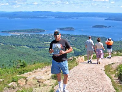 Cadillac Man
Louie Aiello poses with a copy of The Wanderer on Cadillac Mountain overlooking Frenchmen Bay in Bar Harbor, Maine, Acadia National Park. (Photo by and courtesy of Pat Aleks).
