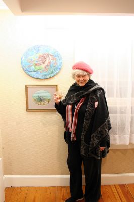 Members Show
Anne MacRae MacLeod poses with her "Beware" and "Ye Oldest Marion Home" at the 2008 Winter Members Show at the Marion Art Center. The show features 73 pieces submitted by over 35 of the MACs members divided between the buildings two main galleries and is open now through February 28. Gallery hours are Tuesday through Friday 1:00 pm to 5:00 pm, and Saturday from 10:00 am to 2:00 pm. (Photo by Robert Chiarito).
