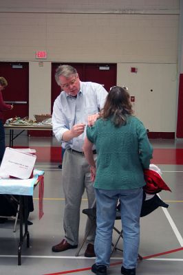Flu Clinic
Dr. Tom Streeter gives a flu shot to a woman during the recent Marion Flu Clinic held at Tabor Academy on November 8. (Photo by Robert Chiarito).
