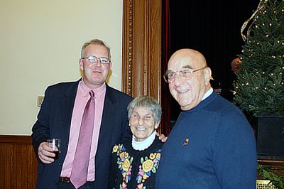 Selectmen's Greetings!
The Marion Board of Selectmen held their annual Christmas Party for Town Hall staff, boards and committees on Tuesday evening, December 2 at the Marion Music Hall. Enjoying the event here are, from left, Planning Board members Tom Magauran and Joseph Napoli with his wife, Lucy (center). (Photo by Kenneth J. Souza).
