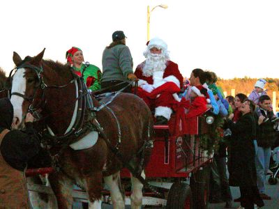 Santa's Sleigh
After arriving in Marion via boat at Island Wharf, Santa Claus mounted a carriage drawn by Clydesdale horses to participate in the town's 2006 Annual Holiday Village Stroll. (Photo by Robert Chiarito).
