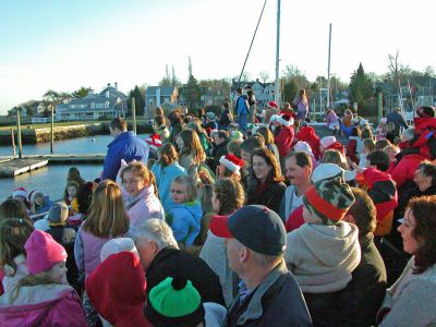 Waiting for Santa
A crowd gathers at Island Wharf in Marion awaiting a special visit from Santa Claus who came to attend the town's Annual Village Stroll via boat. (Photo by Robert Chiarito).
