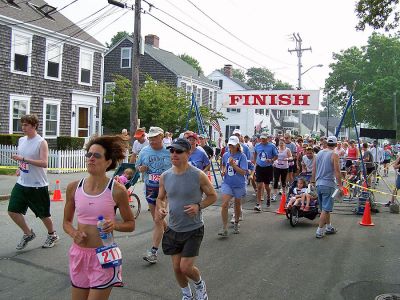 July 4 Road Race
Runners step off for the 36th Annual Mattapoisett Road Race, the town's own July 4 tradition. The 2006 running of the five-mile race ran through Mattapoisett village and around Neds Point Lighthouse. Runners were timed by ankle computer chips.

