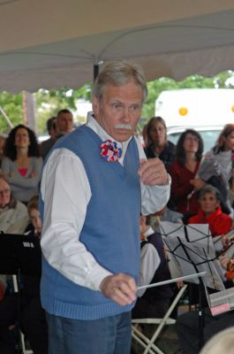 Mattapoisett Birthday Bash
Stan Ellis conducts the Old Hammondtown School Orchestra during Mattapoisett's 150th Birthday Celebration held on Sunday, May 20, 2007 outside Town Hall. (Photo by Tim Smith).
