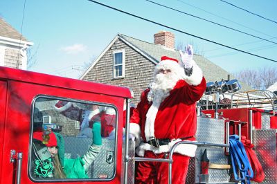 Holiday in the Park 2007
Here Santa arrives by fire truck for Mattapoisett's annual "Holiday in the Park" celebration which was held in Shipyard Park on Saturday, December 1, 2007 and drew a record crowd to the seasonal seaside event. (Photo by Robert Chiarito).
