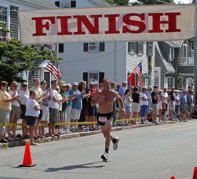 2007 Mattapoisett July 4 Road Race
John Saville of Brockton, MA crosses the finish line in the 37th annual Mattapoisett July 4 Road Race, finishing tenth overall in 30:13 with a pace of 6:03. (Photo by Kenneth J. Souza).
