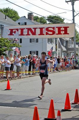 2007 Mattapoisett July 4 Road Race
Douglas Hickey of Mattapoisett crosses the finish line in the 37th annual Mattapoisett July 4 Road Race, finishing fifth overall in 28:58 with a pace of 5:48. (Photo by Kenneth J. Souza).
