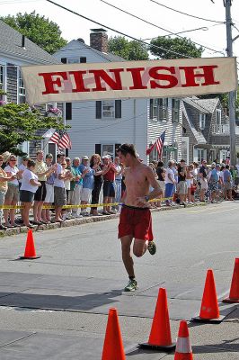 2007 Mattapoisett July 4 Road Race
Kent Taylor of North Dighton, MA crosses the finish line in the 37th annual Mattapoisett July 4 Road Race finishing eighth overall in 29:35 with a pace of 5:55. (Photo by Kenneth J. Souza).
