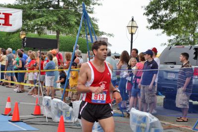 Mattapoisett Road Race 2008
Joe Francisco of Acushnet crosses the finish line in 30:36 to place ninth overall in the Mattapoisett Road Race held on July 4, 2008. (Photo by Kenneth J. Souza).
