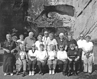 Mattapoisett Touring Club (6/16/05)
Members of the Mattapoisett Touring Club recently traveled to Lucerne, Switzerland and took this photo with a copy of The Wanderer, in front of a sculpture dubbed by author Mark Twain as The Saddest Lion. Pictured here are (first row, l. to r.) Celeste Lake, Fran McCundy, Audrey Mastrom, Betty Botelho, Polly Mostrom, Joan Daley, Diane Hassett, Carol Ripley, (second row, l. to r.) Jan Gallo, Kay Levine, Bill Armitage, Irene Daly, Paul Levine, Roz Pierce, Andre Goulart, Joan Carlson, and Ellen Rogers.
