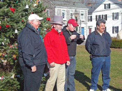 Mattapoisett Holiday Village Stroll 2006
(L. to R.) Mattapoisett Town Administrator Michael Botelho, Selectman Ray Andrews, Selectman Jordan Collyer, and Selectman Steve Lombard participate in the town's first annual Holiday Village Stroll on Saturday, December 2 in Shipyard Park. The event included a visit from Santa Claus, Mrs. Claus, and friends, along with the traditional town tree lighting ceremony. (Photo by Robert Chiarito).
