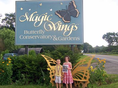 Wandering Wings
Molly and Bob Ross of Rochester pose with The Wanderer at Magic Wings Butterfly Conservatory and Gardens in South Deerfield, MA during a recent trip in July. (Photo courtesy of Sarah Ross). (9/6/07 issue)
