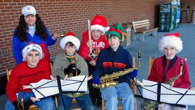 ORR Army Band
Seventh grade musicians from ORR Junior High School (l. to r.) Jack Thomas, Tom Tucker, Ian McLean, and Teddy Kassabian with Seamus McMahon on percussion recently accompanied Salvation Army bell ringer Lucy Genereux of New Bedford (standing, back) at the Stop and Shop in Fairhaven as part of a community service project.
