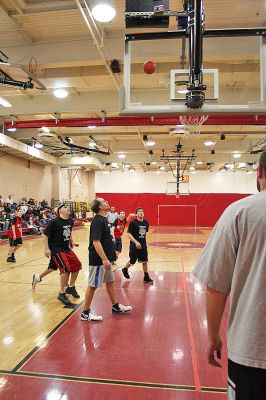 March Madness
Old Rochester Regional Junior High School hosted March Madness Junior, a benefit basketball game on Friday evening, March 14, which pitted the students and faculty against each another. The game, which was organized to benefit the Thuestad family of Mattapoisett and the DeMello family of Rochester, ended with the students narrowly defeating the faculty, 48-47. (Photo by Robert Chiarito).
