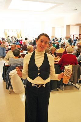 Early Thanksgiving
Student Jessie Hodges was part of the group of student volunteers at Old Rochester Regional Junior High School that served an early Thanksgiving dinner, replete with turkey and all the fixings, on Sunday, November 23 to senior citizens of Marion, Mattapoisett and Rochester. The annual Tri-Town Seniors Thanksgiving pre-holiday event was held inside the ORR Cafeteria and featured a fine meal, raffle and door prizes, and a chance to enjoy the fellowship of young and old alike. (Photo by Robert Chiarito).
