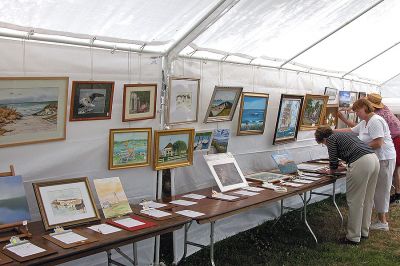 Paint the Town
Works of art -- both previously painted and freshly done -- were on display under a tent during  the fifth annual "Fresh Paint Event" to benefit the Mattapoisett Public Library at Shipyard Park. (Photo by Kenneth J. Souza).
