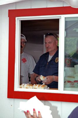 Hot Dog Chief
Rochester Fire Chief Scott Ashworth serves up hot dogs during the 2007 Memorial Day Boat Race on the Mattapoisett River. (Photo by Tim Smith).
