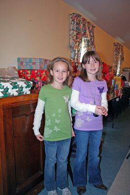 Congregational Christmas
Mila and Tiana Puscizna, sisters who arrived in the United States in February of this year from the Ukraine after being adopted by a local family who belong to Rochesters First Congregational Church, experienced the generosity of Operation Christmas Child firsthand and were able to reciprocate during the churchs holiday fair recently. (Photo by Robert Chiarito).
