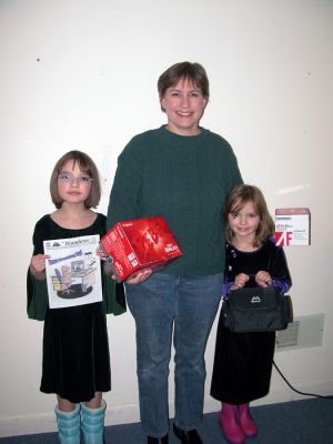 Cover Winners
(L. to R.) Geneva Smith, Marcy Smith and Hannah Smith, all of Rochester, pose with the winning entry in our latest Groundhog Day Cover Contest which was featured on our January 31 edition. The family took home a Canon Rebel XTi camera complete with carrying case and lens package for their efforts. Congratulations to the Smith family and thanks to all who entered! (Photo by Kenneth J. Souza).
