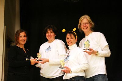 Sea Bees Win
Spelling Bee organizer Geri Owens presents the Seaside School Sea Bees team consisting of Diane Hartley, Rania Lavronos and Trina Waniga with their trophies for winning the Second Annual Lizzie Ts Spelling Bee to benefit Marions Elizabeth Taber Library on Thursday, March 6. The team beat out ten other three-person teams by correctly spelling armagnac in the final elimination round. (Photo by Kenneth J. Souza).
