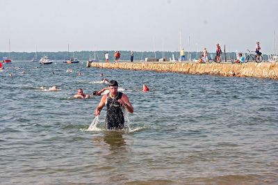 Triple Challenge
Some of the first participants in the 2007 annual Mattapoisett Lions Club Triathlon emerge from the first challenge in the contest: a swim in the waters of Mattapoisett Harbor. (Photo by Robert Chiarito).

