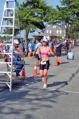 Triple Threat
Katherine McAdoo of Arlington, VA crosses the finish line in the 2008 Mattapoisett Lions Club Triathlon on Sunday, July 13 to finish 26th overall and first in her age group. (Photo by Robert Chiarito).

