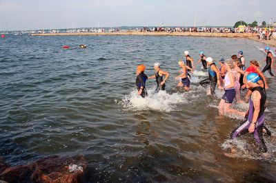 Triple Challenge
Participants in the 2007 annual Mattapoisett Lions Club Triathlon literally dive into the first challenge in the triple event: a swim in the waters of Mattapoisett Harbor. (Photo by Robert Chiarito).
