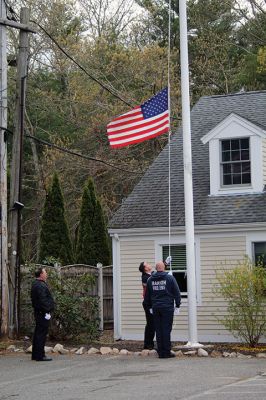Flag Raising
An American flag that was flown at the World Trade Center from September 11, 2001, to November 2, 2001, is touring New England, stopping on Friday night at the Marion Fire Station on Spring Street. Photos by Mick Colageo
