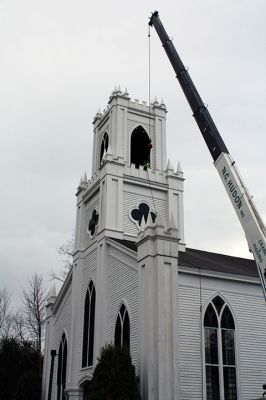 First Congregational Church of Rochester
The bell of the First Congregational Church of Rochester rang above the center of Rochester for the last time this morning, November 20, before it was lowered from the church’s belfry via crane to the ground, the final step of the renovation on the church. The historic bell, created in 1892 by an apprentice of Paul Revere III, grandson to our famous bell maker Paul Revere, will be refurbished and put in storage for some time before it is returned to the church. Photo by Jean Perry
