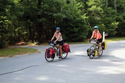 Homecoming Queens 
Colleen Oakes, originally from Marion, and Renee Buteyne, from Rochester, finished the trip of a lifetime on Monday, July 16, having ridden across the United States on their bicycles. Leaving Portland, Oregon on May 2, the two childhood friends arrived at Buteyne’s parents’ driveway about a month earlier than anticipated, greeted by family, friends, confetti, cookies, and of course, hugs. Photos by Jean Perry
