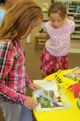 Monarch Moment
Ella Gillen, 10, and Sofia Gillen, 8, watched a chrysalis that originated from their backyard hatch on Tuesday at the Mattapoisett Library. It was serendipity that the two girls were there with their mother, Tracy, to catch the chrysalis beginning to break open to release a fully developed Monarch butterfly into the world. Photos by Jean Perry
