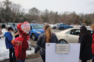 Valentine’s Day Drive-thru
Volunteers distributed over 100 dinners during the Marion Council on Aging’s Valentine’s Day drive-thru event on February 13 at the Cushing Community Center. The dinners donated by Mike Crosby helped make up for the fact the town’s seniors were not able to enjoy Valentine’s Day quite like they did last year inside the building with music and dancing. Photos by Mick Colageo
