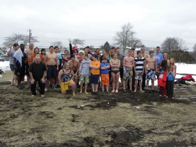 Christmas Swim
A 2009 Christmas morning swim benefitted Helping Hands and Hooves, a Mattapoisett non-profit organization dedicated to therapeutic horseback riding for adults with disabilities. 40 swimmers and at least 50 onlookers participated in the 2009 swim. All of the proceeds from the event went to Helping Hands and Hooves. Photo courtesy of Debbi Dyson.

