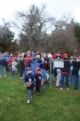 Opening Day
The Rochester Youth Baseball League held their annual opening day ceremony and parade on Saturday, April 11. About 400 people, including players, coaches and their families, participated in the procession that made its way down Route 105 to Gifford Parks Al Herbert Memorial Field for the opening day festivies. Photo by Robert Chiarito.

