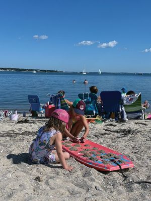 Silvershell Beach
Families make the most of a hot Labor Day at Silvershell Beach in Marion, cooling off in the water and enjoying views of sailboats gliding through the harbor. Photo by Laura Pedulli
