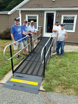 Mattapoisett Lions Club
A team of volunteers from the Mattapoisett Lions Club — including Paul Stubbs, Jeremy Caswell, Bruce Rocha, Jeffrey Swift, Ron Ellis and Fred Avery — installed a metal ramp at a home for a neighbor with mobility issues. Photo courtesy of Paul Stubbs
