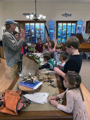 Marion Natural History Museum
On November 30, the Marion Natural History Museum's after-school group had a chance to learn about the different types of trees in our area and to look at some equipment used by foresters to help protect our trees. By looking at a tree "cookie," we were able to count the rings to determine its age and learn about the services, the different sections, including the heart wood, sap wood and bark or phloem provides the tree. 
