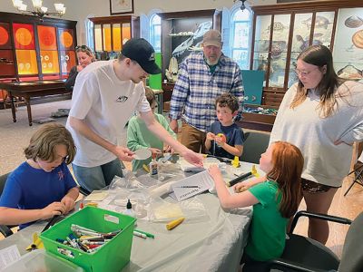 Marion Natural History Museum
The Marion Natural History Museum’s afterschool group had a terrific time constructing their own rockets for launching. This program was so popular it had to be offered twice! The kids had a hands-on introduction to the engineering principles of propulsion and lift. Every rocket managed a successful launch hundreds of feet in the air, and most were safely carried down by the parachutes. The Museum wishes to thank volunteers Mike Cronin and his son Jake for the great program. Photos courtesy Elizabeth Leidho
