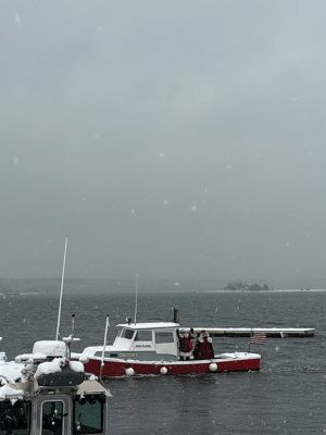 Marion Village Christmas Stroll
The Marion Village Christmas Stroll was this past cold and snowy Sunday. Santa and Ms. Clause arrived by their usual boat, though the cold and the wind sure made it look difficult to dock. Excited kids hurled snowballs all around (and at each other) as they waited for St. Nick. Photo by Sam Bishop
