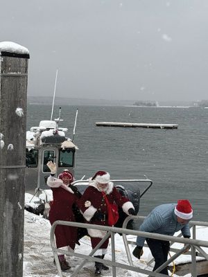 Marion Village Christmas Stroll
The Marion Village Christmas Stroll was this past cold and snowy Sunday. Santa and Ms. Clause arrived by their usual boat, though the cold and the wind sure made it look difficult to dock. Excited kids hurled snowballs all around (and at each other) as they waited for St. Nick. Photo by Sam Bishop
