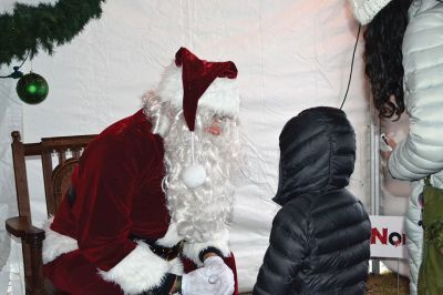 Holiday in the Park
It looked like another record turnout at Shipyard Park in Mattapoisett on December 9 for the annual Holiday in the Park and tree lighting. The tent was stuffed with hot foods, cocoa, donuts, Christmas cookies, and the hundreds of people in line to warm up out of the snowy cold. Did you miss the tree lighting? See The Wanderer Facebook page for a video capturing the magical moment. Photos by Jean Perry 
