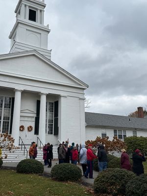 Veterans Day
Attendees to the Veterans Day celebrations in Mattapoisett this past Tuesday. They gathered at the front of the Mattapoisett Congressional Church to await the bells ringing at 11:00 am. As they waited, a few stray snowflakes drifted down from a white sky. Following that, they walked across the street to Center School for performances by the Showstoppers and The Old Hammondtown Band. Photo by Sam Bishop
