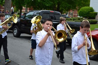Memorial Day 2014
Scores of Mattapoisett residents gathered in front of the Mattapoisett Free Library the drizzly afternoon of May 26 to pay homage to veteran Americans who lost their lives. Onlookers filled the lawn and spilled out into the street to watch the Memorial Day ceremony with special guest speaker Navy Reserve Commander Paul J. Brawley who served more than 22 years of active duty and reserve service. After the ceremony, participants paraded through the town to the town wharf. Photo By Jean Perry
