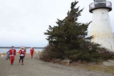 Mattapoisett Santa Stampede
The Mattapoisett Santa Stampede took place on Saturday, December 6 with over 300 Santas taking place. The 5K began at Shipyard Park and cut down Ned’s Point Road to the point, around the lighthouse and back. The Grinch led the pack on his bike, and residents stood by to cheer on all the runners. Photos by Sam Bishop and Mick Colageo

