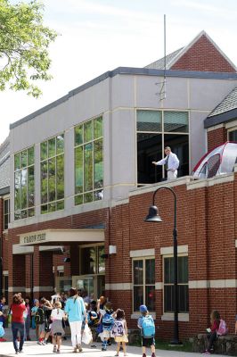 Mr. T!
Students chanted “Mr. T!” to Mr. Tavares on the roof as they left school June 18. Kevin Tavares, associate principal, challenged the kids to raise 481 canned goods to top Mr. T’s 480 – they collected over 800 instead! Mr. T had to spend the night on the roof of Center School, calling the community out to visit him and bring canned goods so he could match the students’ grand total. Photos by Jean Perry
