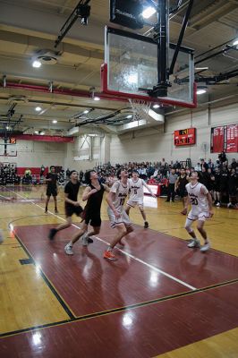 ORRHS Boys’ Basketball 
The Old Rochester Regional High School boys’ basketball team had the support of a packed gymnasium for MIAA Division 3 tournament wins over Foxboro, Salem (pictured) and Dover-Sherborn. Having run the table on home court, the second-seeded Bulldogs went to Worcester State on Monday night and defeated Pittsfield to earn a spot in the state championship this weekend in Lowell. Photo by Mick Colageo

