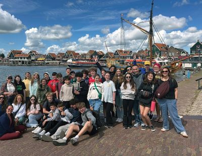ORRJH in The Netherlands
A group of ORRJHS students recently traveled to The Netherlands, Germany, and Poland for an experiential learning trip. Pictured here: the group in Volendam, Holland, with eighth grader Wayne Dauphine in the center holding a spring (April) issue of the Wanderer. Photo courtesy Nichole Charbonneau
